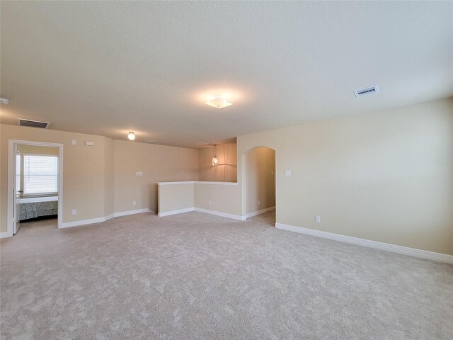 3430 Hughes Meadow Way, Richmond, TX 77406 - unfurnished room featuring arched walkways, light carpet, and baseboards