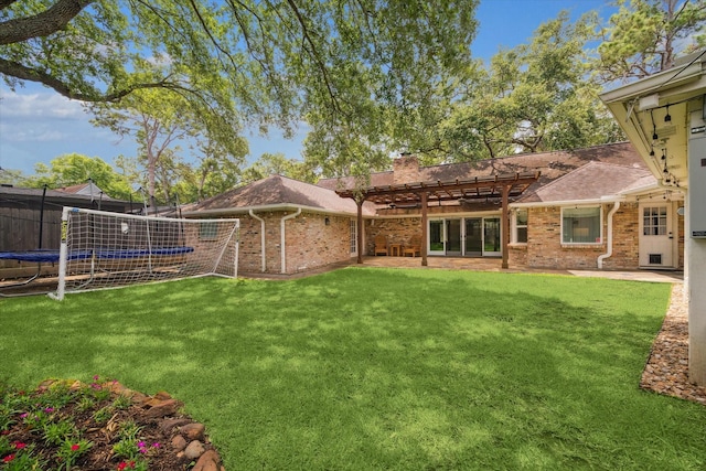 12310 Woodthorpe Ln, Houston, TX 77024 - view of green lawn with a pergola, a trampoline, and a patio area
