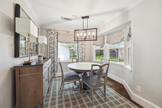 12310 Woodthorpe Ln, Houston, TX 77024 - dining room with baseboards, ornamental molding, and a chandelier
