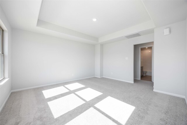 11765 Whirlaway Dr, Willis, TX 77318 - carpeted spare room with a raised ceiling, baseboards, and recessed lighting