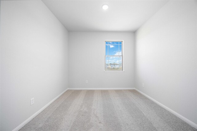 11765 Whirlaway Dr, Willis, TX 77318 - carpeted empty room with baseboards