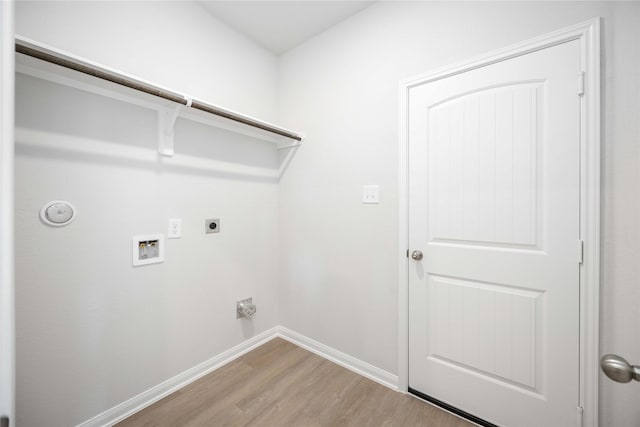 11765 Whirlaway Dr, Willis, TX 77318 - washroom with light wood finished floors, hookup for a washing machine, electric dryer hookup, and baseboards