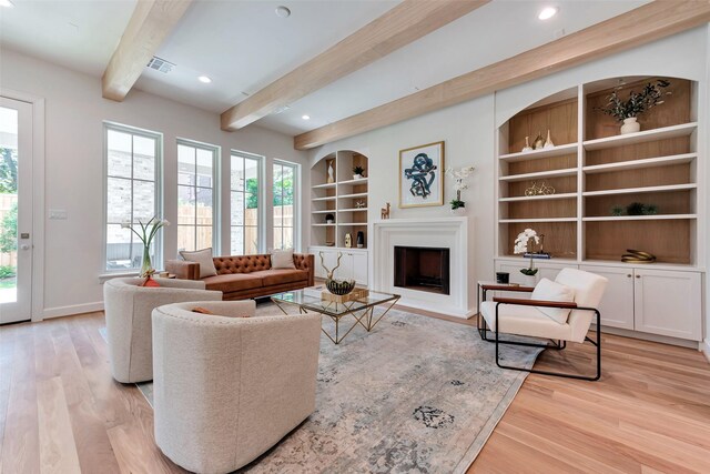 3314 La Salle St, Houston, TX 77027 - living area featuring light wood-style floors, beam ceiling, built in features, a fireplace, and recessed lighting