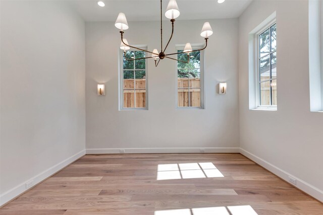 3314 La Salle St, Houston, TX 77027 - unfurnished room featuring a chandelier, wood finished floors, and recessed lighting