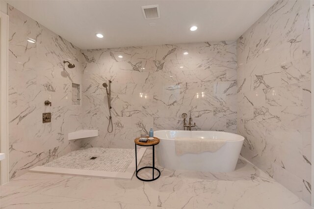 3314 La Salle St, Houston, TX 77027 - bathroom with marble tiled flooring, a marble finish shower, a soaking tub, stone wall, and recessed lighting