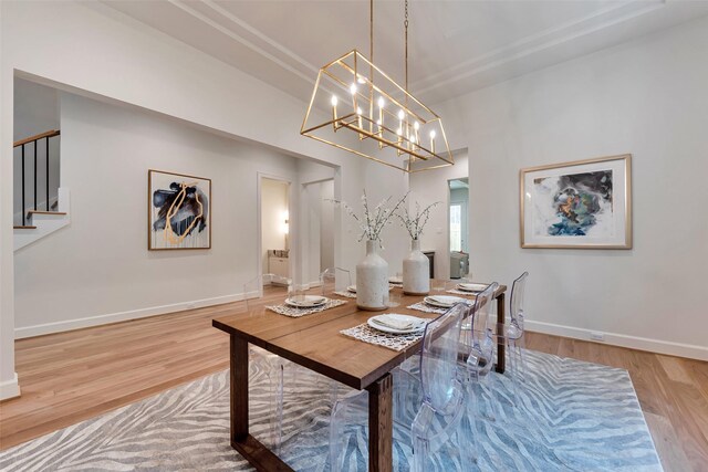 3314 La Salle St, Houston, TX 77027 - dining room featuring wood finished floors, stairs, and a chandelier