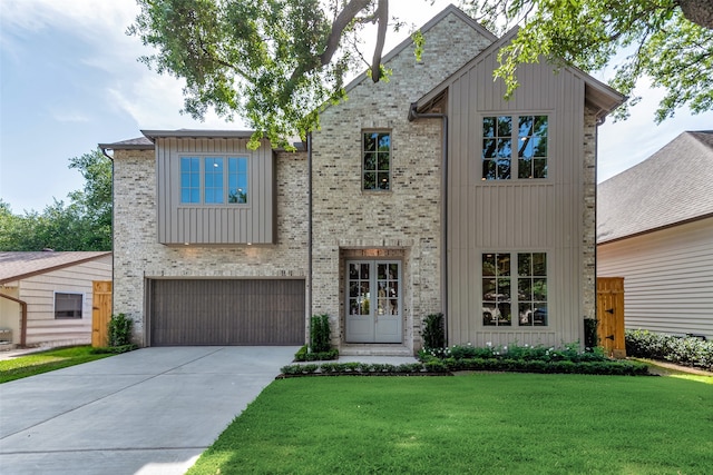 3314 La Salle St, Houston, TX 77027 - view of front of house featuring driveway, a garage, a front lawn, and board and batten siding