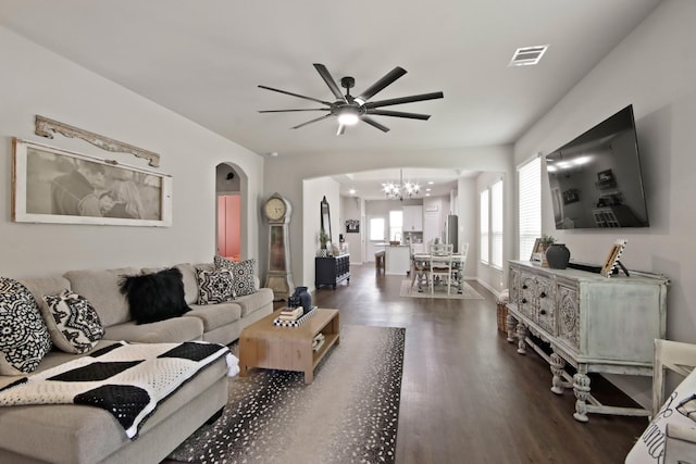 17723 Chartertree Ln, Tomball, TX 77377 - living area featuring a chandelier, ceiling fan, wood finished floors, arched walkways, and baseboards