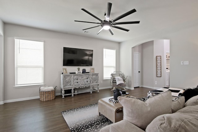 17723 Chartertree Ln, Tomball, TX 77377 - living room featuring ceiling fan, arched walkways, dark wood-style flooring, and baseboards