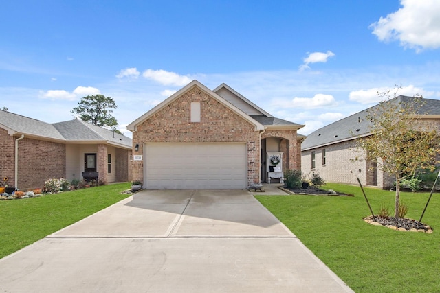 17723 Chartertree Ln, Tomball, TX 77377 - view of front of house with brick siding, concrete driveway, a front yard, and a garage