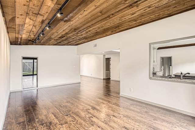 6509 Birdwood Rd, Houston, TX 77074 - spare room featuring track lighting, hardwood / wood-style floors, a sink, baseboards, and wooden ceiling