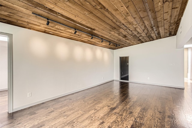 6509 Birdwood Rd, Houston, TX 77074 - spare room featuring rail lighting, dark wood-type flooring, baseboards, and wood ceiling