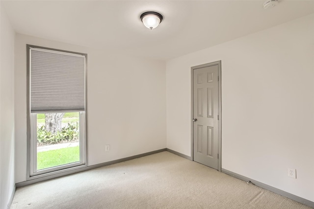 6509 Birdwood Rd, Houston, TX 77074 - spare room with light carpet, baseboards, and a smoke detector
