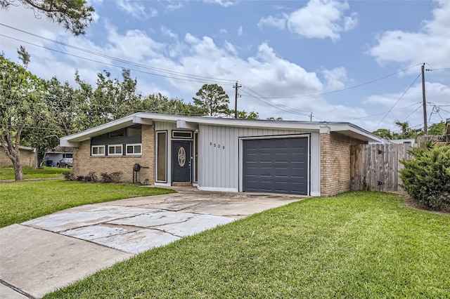 6509 Birdwood Rd, Houston, TX 77074 - mid-century modern home featuring brick siding, driveway, and an attached garage