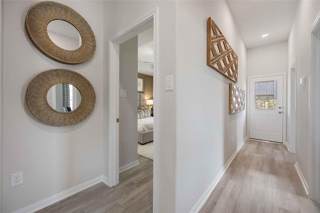12235 Danza Dr, Willis, TX 77318 - corridor with light wood-style floors, baseboards, and recessed lighting
