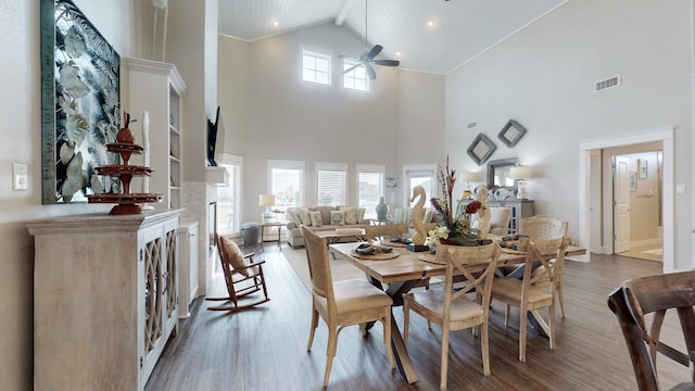 985 Sue Dr, Crystal Beach, TX 77650 - dining room with high vaulted ceiling, ceiling fan, wood finished floors, and recessed lighting