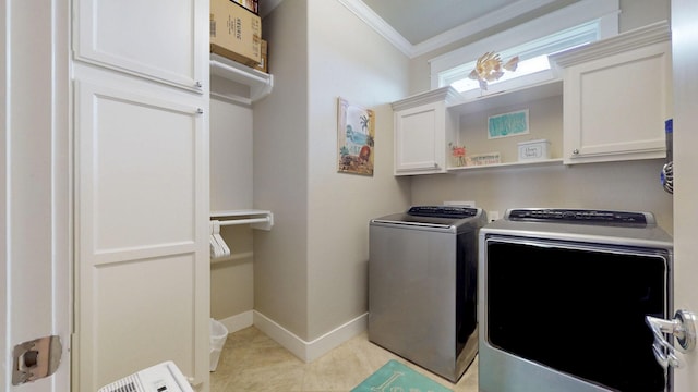 985 Sue Dr, Crystal Beach, TX 77650 - washroom with cabinet space, washer and dryer, crown molding, baseboards, and light tile patterned floors