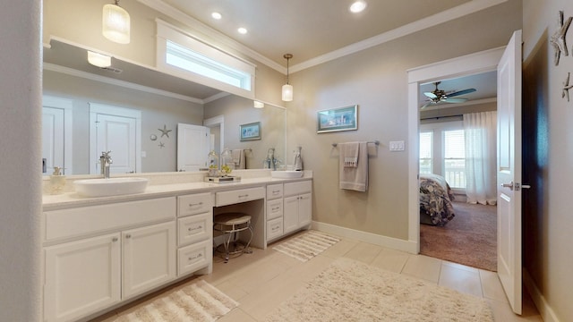 985 Sue Dr, Crystal Beach, TX 77650 - bathroom with crown molding, double vanity, connected bathroom, tile patterned flooring, and recessed lighting