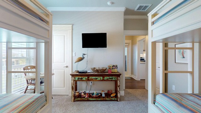 985 Sue Dr, Crystal Beach, TX 77650 - bedroom featuring crown molding and carpet floors
