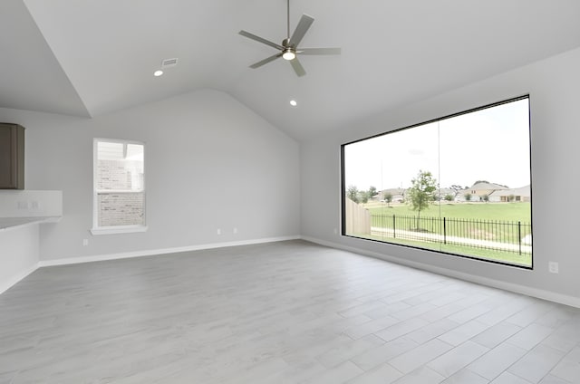 18207 Walnut Canopy Way, Tomball, TX 77377 - unfurnished living room featuring lofted ceiling, a ceiling fan, baseboards, recessed lighting, and light wood-style flooring