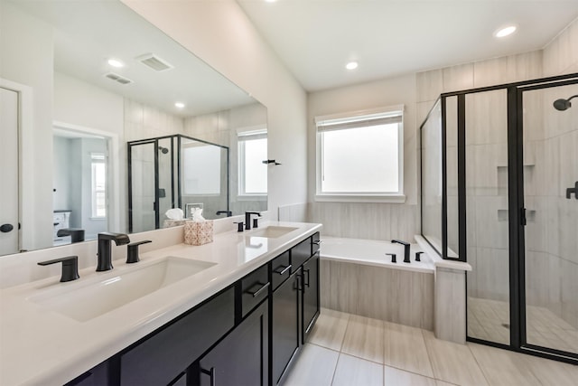 21606 Laggan Cliff Ln, Cypress, TX 77433 - full bath featuring a stall shower, a garden tub, tile patterned floors, double vanity, and recessed lighting