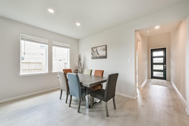 21606 Laggan Cliff Ln, Cypress, TX 77433 - dining space featuring recessed lighting, light wood-style floors, and baseboards