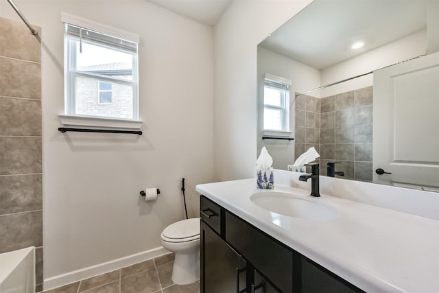 21606 Laggan Cliff Ln, Cypress, TX 77433 - full bath with toilet, baseboards, vanity, and tile patterned flooring