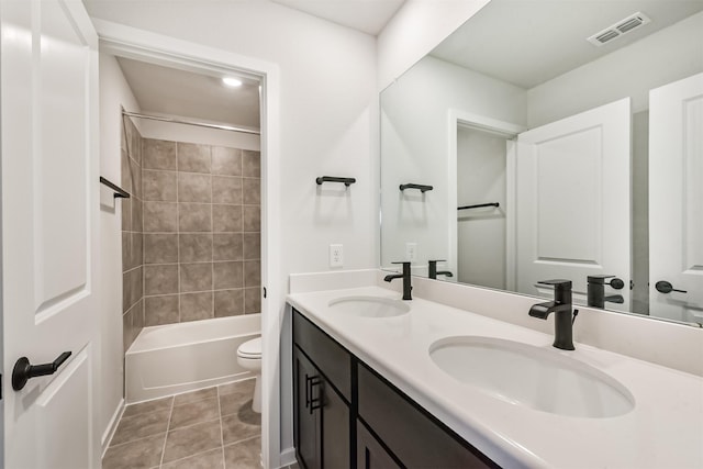 21606 Laggan Cliff Ln, Cypress, TX 77433 - bathroom featuring toilet, double vanity, tile patterned flooring, and bathtub / shower combination