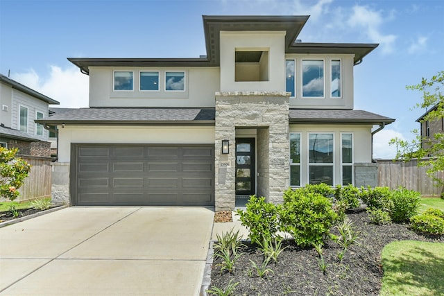 21606 Laggan Cliff Ln, Cypress, TX 77433 - view of front of house with stucco siding, fence, an attached garage, and concrete driveway