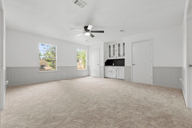 5310 Brownlee Ln, Spring, TX 77379 - empty room with wainscoting, a ceiling fan, and carpet floors