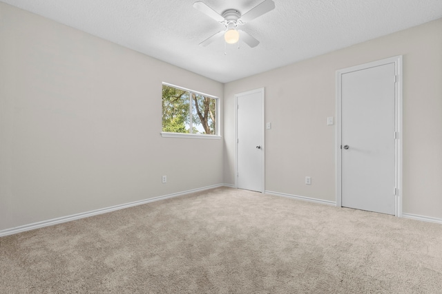 5310 Brownlee Ln, Spring, TX 77379 - unfurnished bedroom featuring a textured ceiling, baseboards, carpet, and a ceiling fan