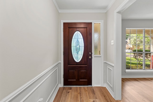 5310 Brownlee Ln, Spring, TX 77379 - entrance foyer with wood finished floors, plenty of natural light, a wainscoted wall, a decorative wall, and ornamental molding