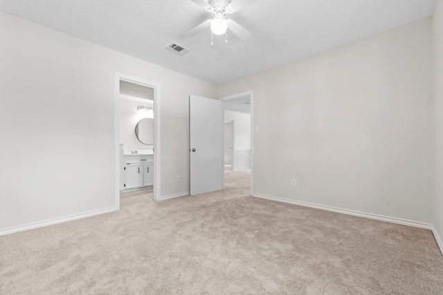 5310 Brownlee Ln, Spring, TX 77379 - unfurnished bedroom featuring light colored carpet, baseboards, ensuite bath, and a ceiling fan