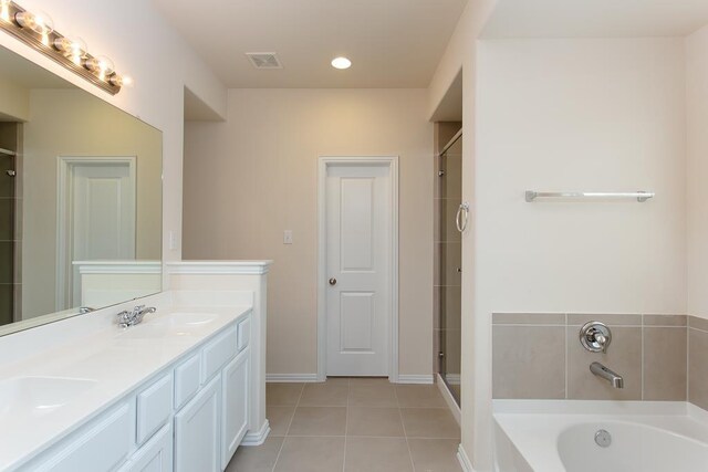 1626 Summer City Dr, Houston, TX 77047 - full bath with tile patterned floors, double vanity, a bath, a shower with shower door, and baseboards