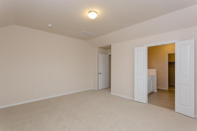 1626 Summer City Dr, Houston, TX 77047 - unfurnished bedroom with light carpet, vaulted ceiling, and baseboards