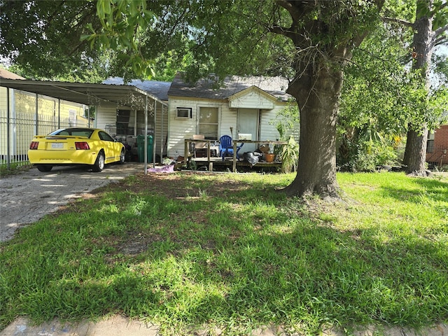 view of front facade with an attached carport and driveway