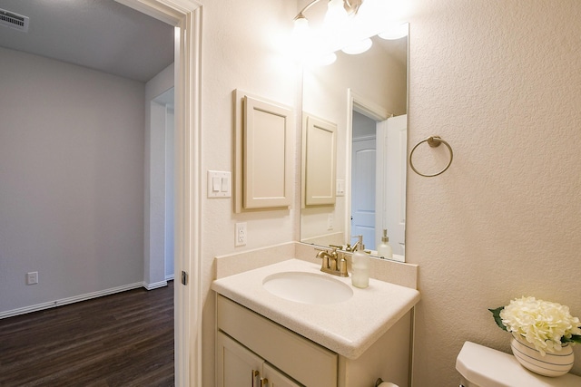 209 Cambria Green Ln, Katy, TX 77493 - bathroom featuring wood finished floors, vanity, and toilet