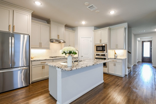 209 Cambria Green Ln, Katy, TX 77493 - kitchen featuring stainless steel appliances, decorative backsplash, dark wood-type flooring, and recessed lighting
