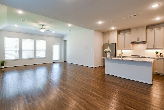 209 Cambria Green Ln, Katy, TX 77493 - kitchen with a ceiling fan, a sink, freestanding refrigerator, a kitchen island with sink, and dark wood-type flooring