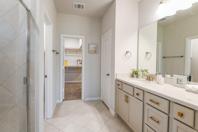 209 Cambria Green Ln, Katy, TX 77493 - full bath with a shower stall, vanity, a walk in closet, and tile patterned floors