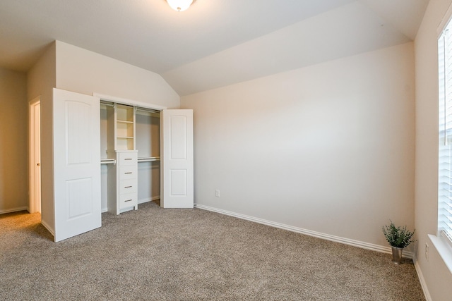 209 Cambria Green Ln, Katy, TX 77493 - unfurnished bedroom with carpet floors, a closet, vaulted ceiling, and baseboards