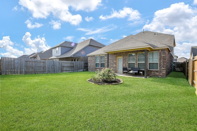 209 Cambria Green Ln, Katy, TX 77493 - back of house with brick siding, a patio area, and roof with shingles