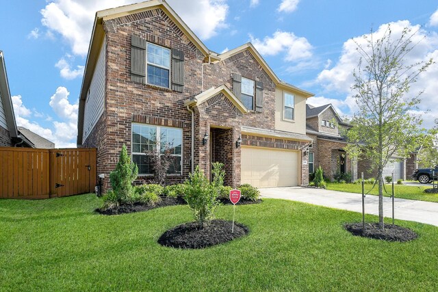 209 Cambria Green Ln, Katy, TX 77493 - traditional-style house with brick siding, driveway, a garage, and a gate
