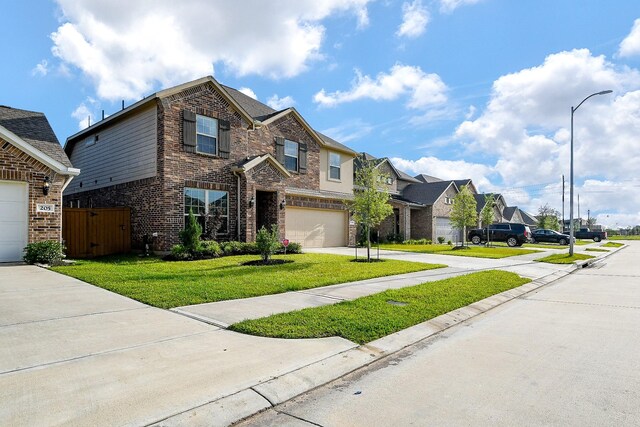 209 Cambria Green Ln, Katy, TX 77493 - traditional-style house featuring a residential view, concrete driveway, a garage, and brick siding