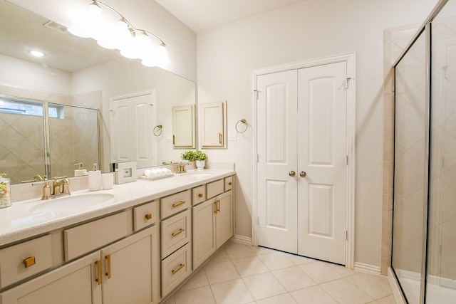 209 Cambria Green Ln, Katy, TX 77493 - bathroom with a shower stall, double vanity, tile patterned floors, and baseboards