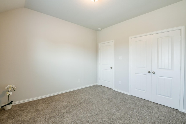 209 Cambria Green Ln, Katy, TX 77493 - unfurnished bedroom featuring carpet, a closet, vaulted ceiling, and baseboards