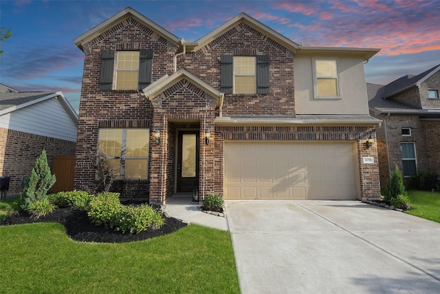 209 Cambria Green Ln, Katy, TX 77493 - traditional-style house featuring concrete driveway, brick siding, and an attached garage