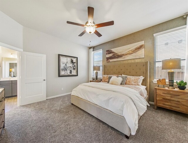 7911 Palm Sails Ln, Cypress, TX 77433 - bedroom with carpet, baseboards, connected bathroom, and ceiling fan