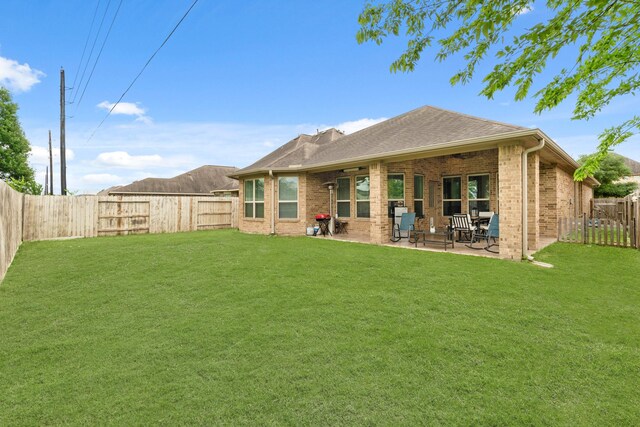 17222 Fable Springs Ln, Cypress, TX 77433 - back of property with brick siding and a patio area