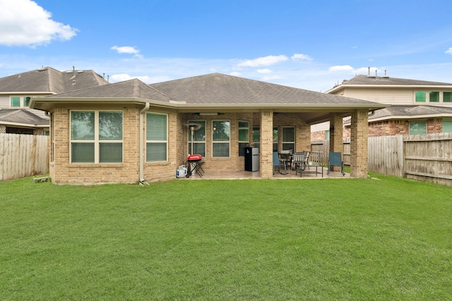 17222 Fable Springs Ln, Cypress, TX 77433 - back of house with a patio, brick siding, and a shingled roof